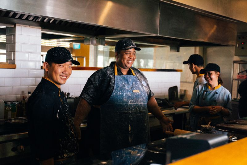 Friendly front of house staff at Anthony's coal fired pizza ready to serve